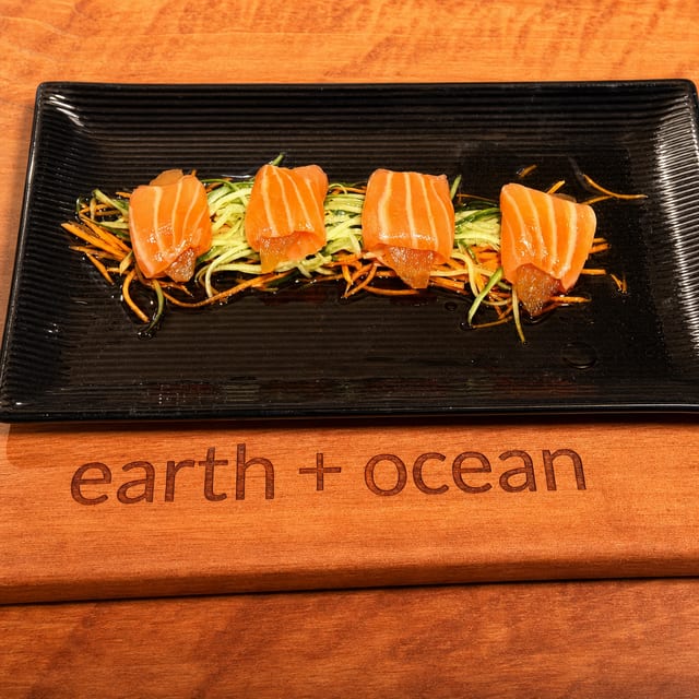 Poached Pear wrapped in thin, sliced salmon.